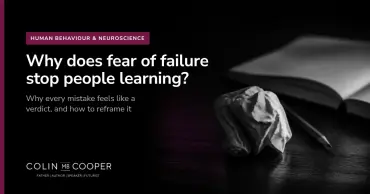 Article card: Why does fear of failure stop people learning? AI-generated image of a crumpled sheet of paper beside an open notebook
