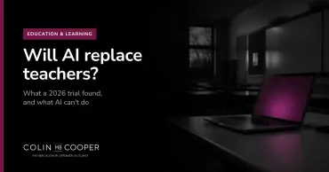 Article card: Will AI replace teachers? AI-generated image of an empty classroom at dusk with a laptop open on the teacher's desk